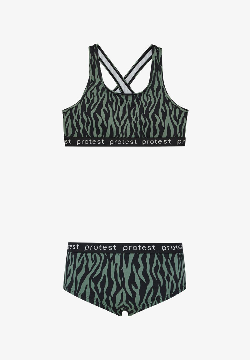 Sportovní podprsenka se zebrovým vzorem v zelené a černé barvě, s křížovými ramínky a černým elastickým páskem s opakujícím se bílým textem. Součástí balení je odpovídající spodní prádlo.