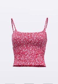 Růžový květinový crop top s tenkými ramínky, přiléhavým střihem a texturovanou látkou s bílými květinovými vzory po celé ploše.