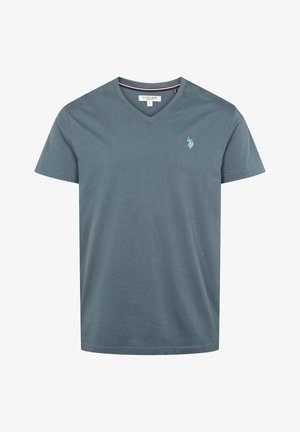 Tumedat sinises varrukateta T-särk, mis on valmistatud pehmest puuvillast, V-kaelusega ja vasakpoolsel rinnal on väike roheline hobuse logo.