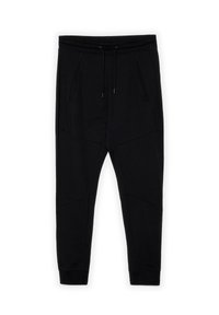 Pantalones de chándal negros hechos de una tela suave, con una cinturilla elástica con cordones, bolsillos laterales y detalles de costura geométricos.