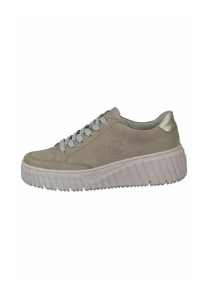 Light beige suede sneaker with gray laces and metallic gold heel accent. Features a thick, textured white sole. Logo on side.