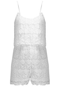 Vit spetsromper med tunna axelband, blommönster, vågig nederkant och lös passform. Tillverkad av lätt och delikat spetstyg.
