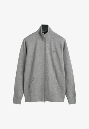 Grå zip-up sweatshirt med høj krave, sidelommer og ribstrikkede manchetter. Lavet af blødt materiale med et lille logo broderet på brystet.