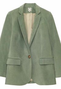Blazer en daim vert avec un col à revers, fermeture à un bouton, et deux poches plaquées à l'avant. Doublure intérieure lisse de couleur crème.