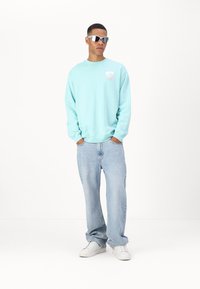 Marimekko LOISTO UNIKKO UNISEX - Melegítőfelső - turquoise