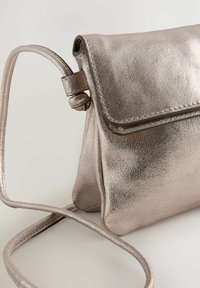 Next FLAP - Bandolera - gold