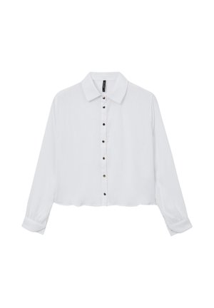 Blusa bianca a maniche lunghe corta con colletto a punta, coste verticali sul davanti e bottoni neri al centro.