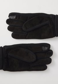 Schwarze Handschuhe aus weichem Wildleder mit elastischen Bündchen. Verfügen über Lederakzente am Daumen und Handfläche für zusätzlichen Grip und Touch-Funktionalität.