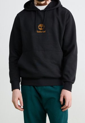 Schwarzer Kapuzenpullover aus Baumwollgemisch, mit einer vorderen Tasche und einem gestickten Timberland-Logo in Braun. Rippbündchen und Saum.