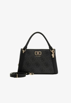 Black Guess handbag with monogram pattern, gold logo and hardware, single top handle, and detachable shoulder strap on white background.