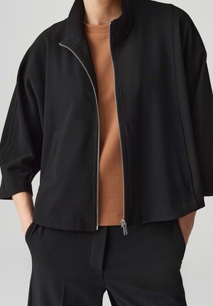 Välikausitakki - black