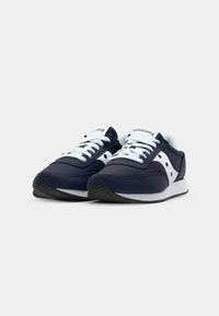 Navy blue sneakers with a smooth leather upper, white laces and logo, featuring a textured black rubber sole and contrasting white accents.