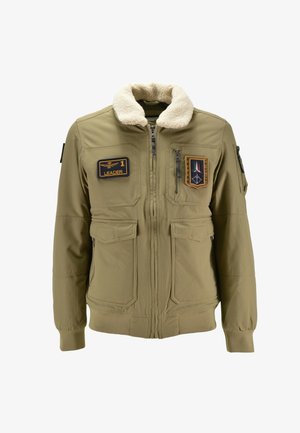 Giacca bomber khaki con colletto in finta shearling, multiple tasche e toppe con la scritta "LEADER" e altri distintivi.