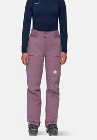 Purple ski pants made of water-resistant material, featuring two front pockets, reinforced cuffs, and a logo detail on the thigh.