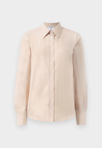 Beige long-sleeve button-up shirt with a classic collar, featuring a smooth texture, plain design, and white buttons along the front.