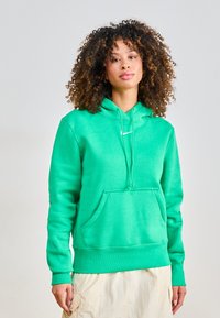 Green hoodie made of soft material with a front pocket, drawstring hood, and ribbed cuffs. Features a small white logo on the chest.