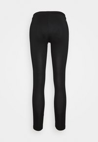 Schwarze Leggings aus einem glatten, dehnbaren Stoff. Sie haben einen hohen Bund und eine enganliegende Passform, die zu den Knöcheln hin schmaler wird. Keine sichtbaren Logos.