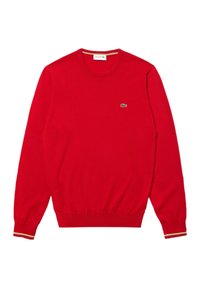 Maglione rosso a maniche lunghe con scollo a crew, dotato di polsini e orlo a coste, con un piccolo logo di un coccodrillo ricamato in verde sul lato sinistro del petto.