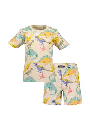 Lyhythihainen t-paita ja siihen sopivat shortsit pehmeää beigeä puuvillaa, joissa värikkäitä dinosauruskuvioita sinisen, vihreän, keltaisen ja pinkin sävyissä.