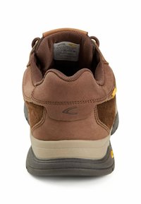 Brown suede and mesh hiking shoe featuring a cushioned collar, rubber sole, and yellow accent near the heel. Designed for durability and comfort.