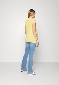 Esprit Maternity PANTS OVER THE BELLY  - Calças de ganga à boca de sino - medium wash