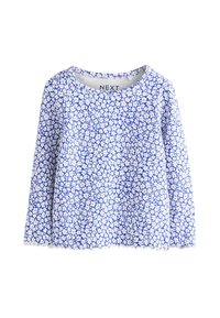 Hosszú ujjú kék virágmintás felső, fehér virágmintával, bordázott nyakkivágással és hullámos szegéllyel. Puha, könnyű anyagból készült.
