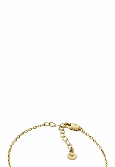 Bracciale in oro con chiusura a moschettone, catena regolabile e un piccolo disco rotondo con un logo decorativo.