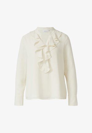 Kremowa bluzka z falbaną przy kołnierzyku i guzikiem na przedzie. Długie rękawy zakończone guzikami. Lekki, gładki materiał o subtelnym połysku.