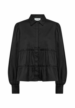 Blouse noire à manches longues avec col, boutons dissimulés sur le devant, volants froncés sur le corps et poignets smockés aux manches.
