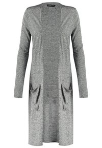 Lång öppen cardigan i grått stickat tyg med två framfickor. Har långa ärmar och en texturerad yta. Minimalistisk design.