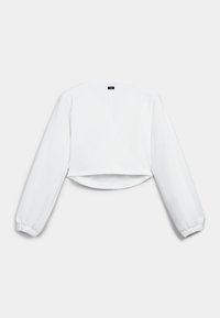Sweatshirt blanc court avec des manches longues, des poignets élastiques et un ourlet droit. Présente une couture centrale à l'arrière et une étiquette au niveau du col.
