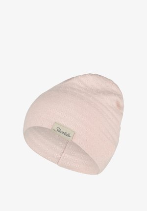 Soft pink knitted beanie with subtle floral texture and a small rectangular fabric label stitched on the brim.