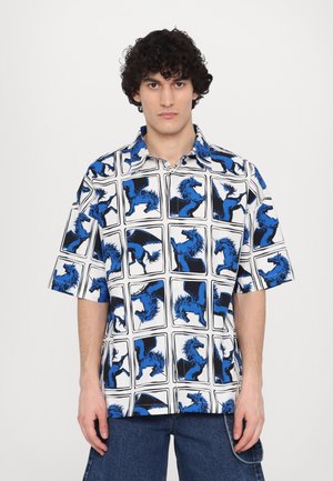 Short-sleeve shirt with blue horse silhouettes on a white background. Features a collared neck and relaxed fit, made from lightweight fabric.