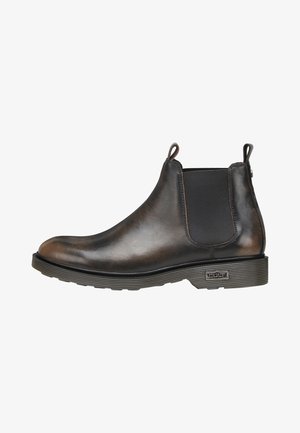 Bruine leren Chelsea-boots met elastische zijpanelen, ronde neus en gestructureerde rubberen zool. Trekflappen voor gemakkelijke aan- en uittrekking.