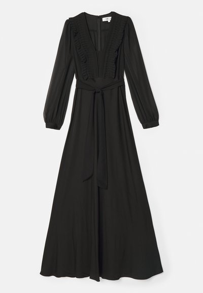 Robe longue noire avec un décolleté en V profond, détails en volants sur le devant, manches longues et taille ceinturée. Tissu doux et fluide.