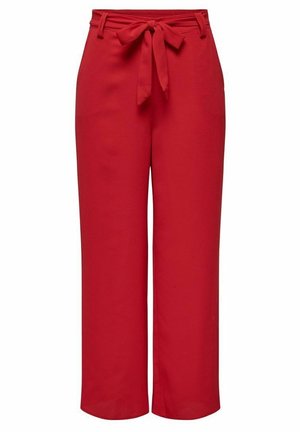 Pantalones rojos de pernera ancha con cintura alta, trabillas para cinturón y un lazo de tela anudado al frente.