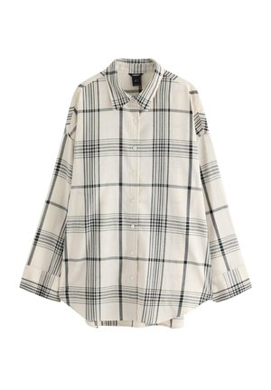 Cremefarvet langærmet skjorte med knapper og et sort og gråt ternet mønster, klassisk krave og en løs pasform.