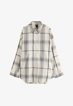 Crèmefärgad långärmad skjorta med knäppning, svart och grå rutmönster, klassisk krage och lös passform.
