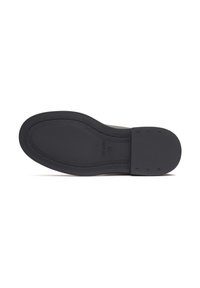 Talpa de cauciuc neagră cu un model texturat de tread și detalii cu logo. Zona călcâiului este solidă și are margini rotunjite pentru stabilitate.