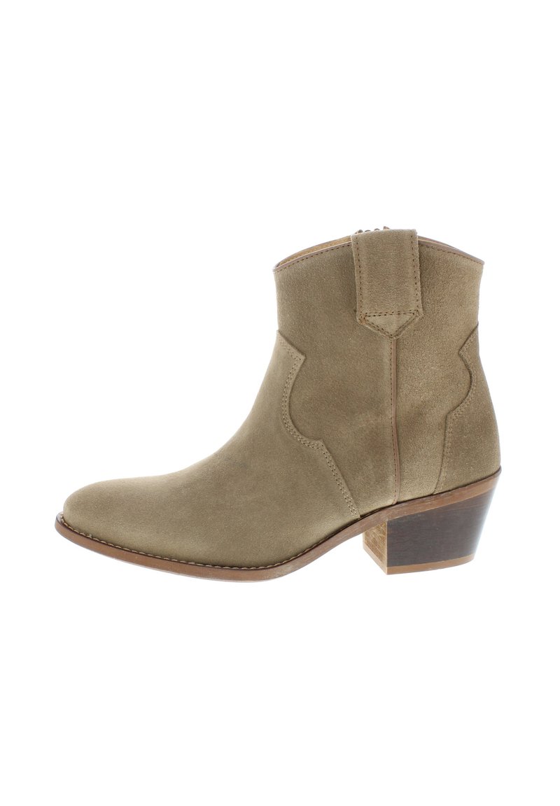 Suede ankle boot in olive green with a pointed toe, stitched detailing, and a stacked wooden heel. Side pull tab for easy wear.