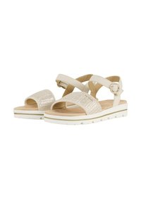 Sandalias beige con correas trenzadas, correa en el tobillo ajustable, plantilla acolchada y suela blanca texturizada. Adecuadas para uso casual.
