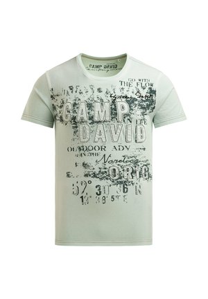 Light green short-sleeve t-shirt with black distressed text, including "CAMP DAVID," "GO WITH THE FLOW," and coordinate-style numbers.