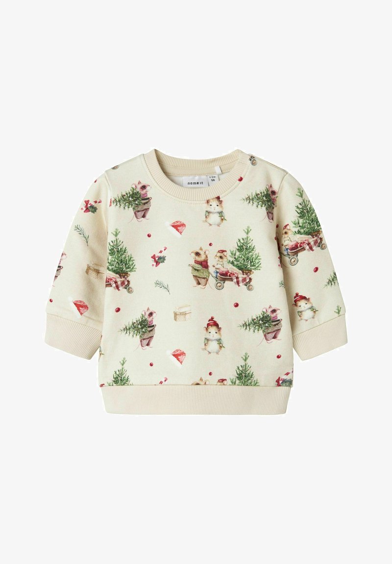 Sudadera de un tono beige claro con un patrón festivo de animales, árboles y ornaments. Puños y dobladillo acanalados, textura de tela suave.