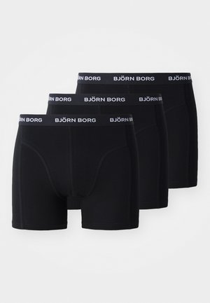 Mugavad mustad bokserid pehmest kangast, millel on tihe istuvus, õmblustähtsus ja lai must vöö, millel on valge trükitud "BJÖRN BORG" logo.