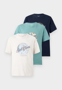 Three Jack & Jones crew neck t-shirts in cream, teal, and navy with circular botanical designs and logo text on the front.