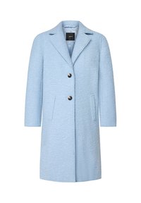 Manteau bleu clair en mélange de laine avec une surface texturée, col à revers, deux poches avant et deux boutons noirs pour la fermeture.