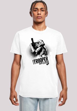 White cotton t-shirt featuring black graphic print of a stormtrooper holding a blaster, with bold text “STORM TROOPER” below.