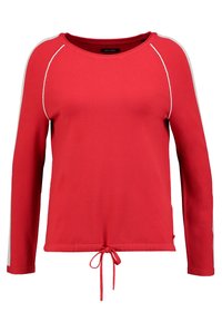 Maglietta rossa a maniche lunghe con scollatura rotonda, orlo con cordoncino e dettagli bianchi a contrasto sulle spalle. Tessuto liscio e morbido.