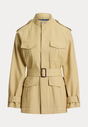 Beeži värvi vöökohaga jakk kõrge krae, neli esimest taskut kaanega, õlapaelad ja reguleeritavad mansettrihmad.