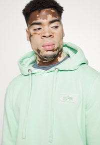 Alpha Industries Kapucni - mint